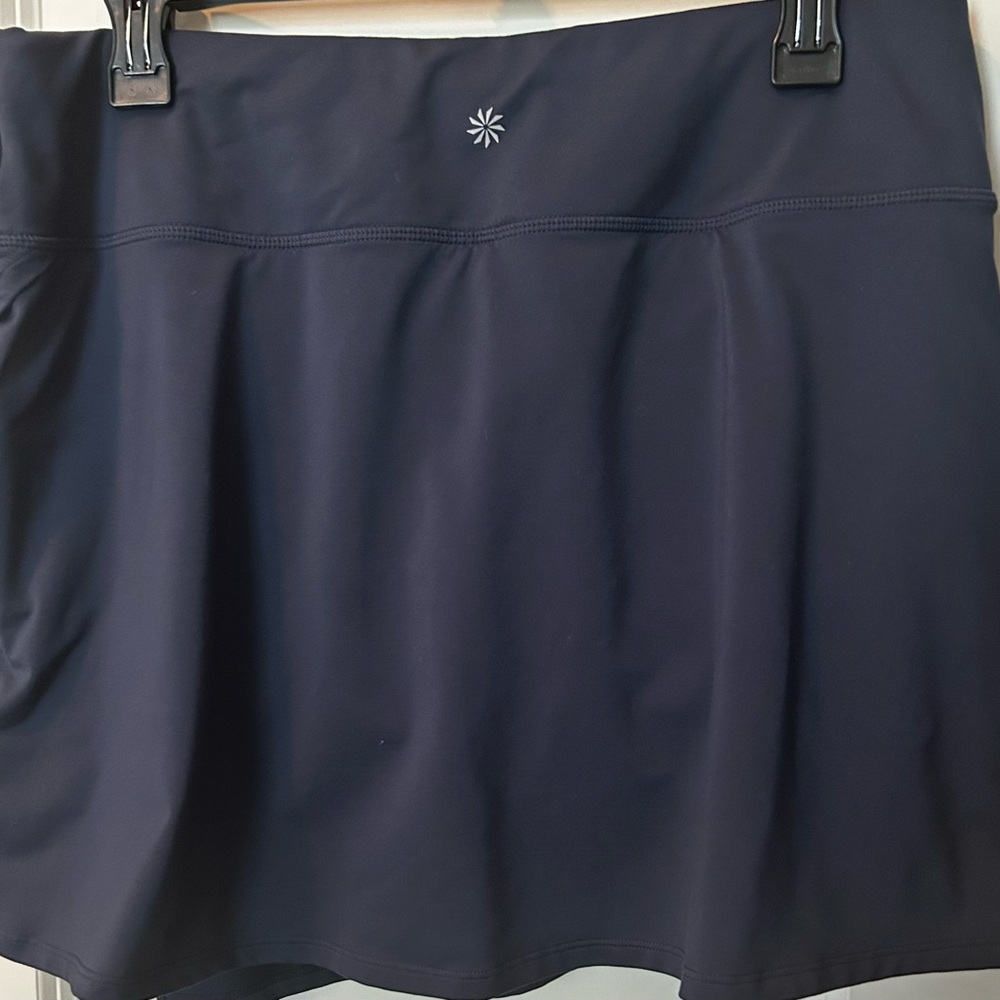 Women’s Athleta tennis, running, athletic skirt in dark blue. Size Large